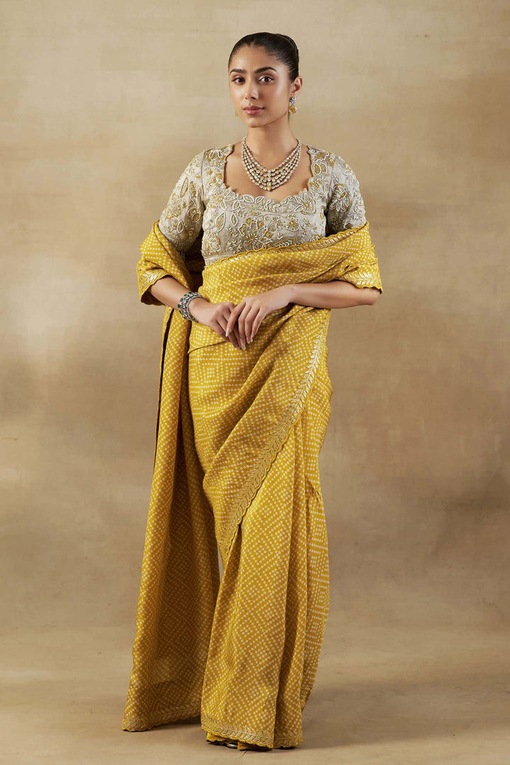 YELLOW BANDHANI TISSUE SAREE WITH EMBROIDERED BLOUSE