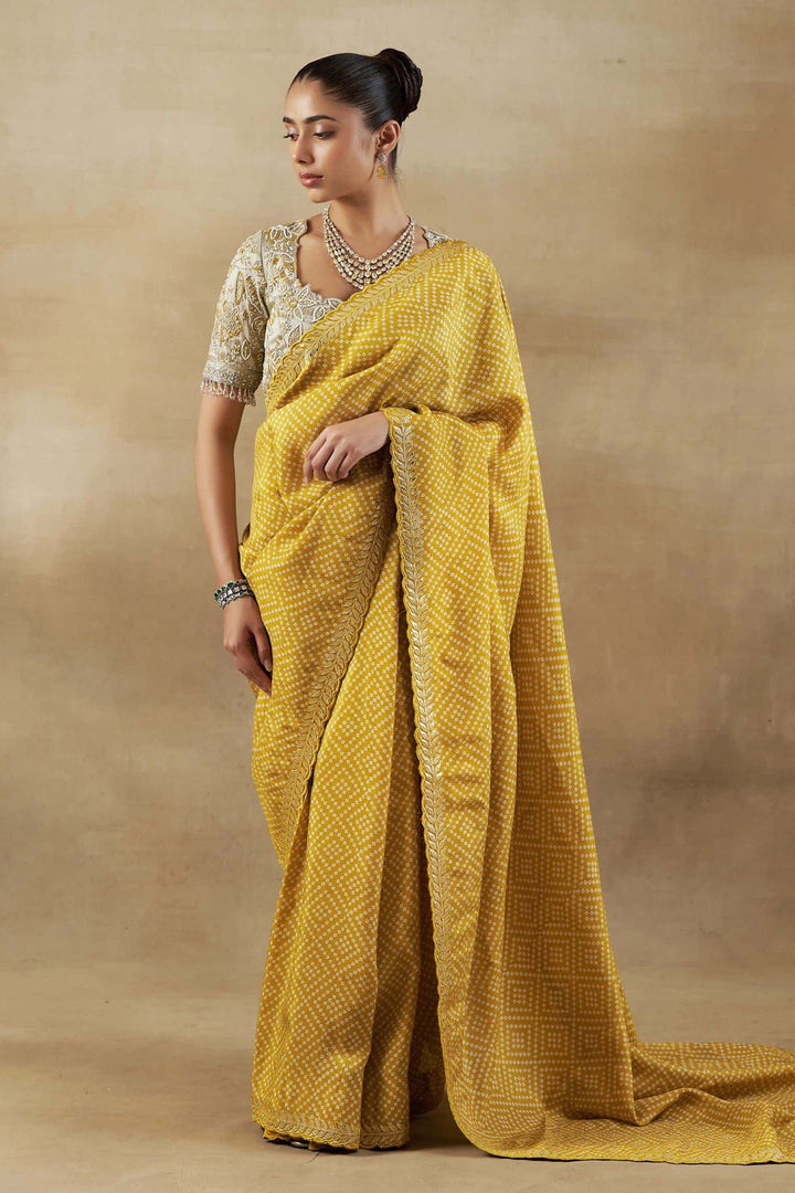 YELLOW BANDHANI TISSUE SAREE WITH EMBROIDERED BLOUSE