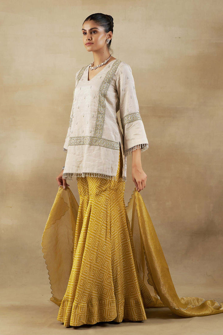 Silver Tissue Short Kurta with Mustard Bandhani Garara and Gold Self Weave Zari Dupatta