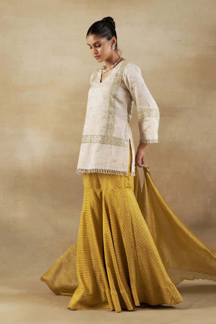 Silver Tissue Short Kurta with Mustard Bandhani Garara and Gold Self Weave Zari Dupatta